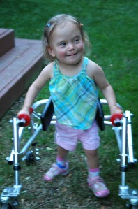 At 3 years old, she was able to get around on her own with a walker.  She was thrilled to be able to move around on her feet, but she still couldn't keep up with her friends. 